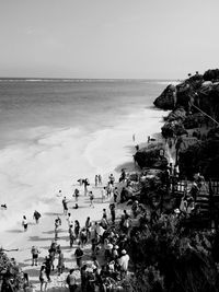 High angle view of people at beach against sky