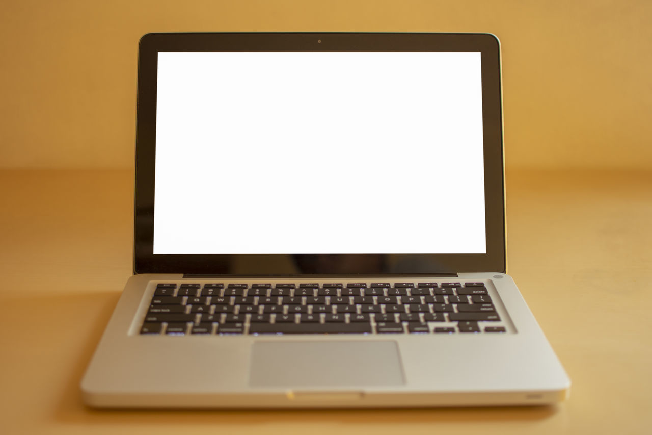 LOW ANGLE VIEW OF LAPTOP KEYBOARD