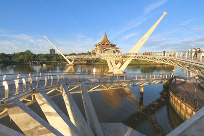 Bridge over river with buildings in background