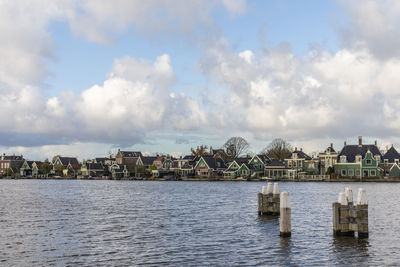 Panoramic view of river and buildings against sky