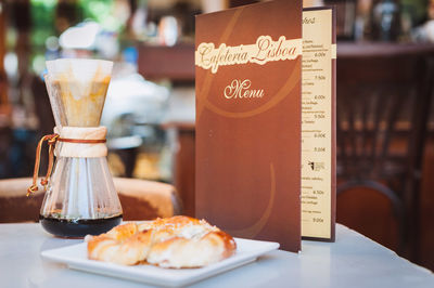 Close-up of food served in plate on table at cafe