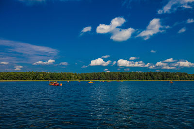 Scenic view of sea against blue sky