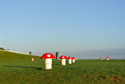 Lifeguard hut on field against clear sky