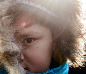 Close-up portrait of boy wearing fur hat