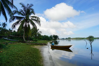 Boat in lake against sky