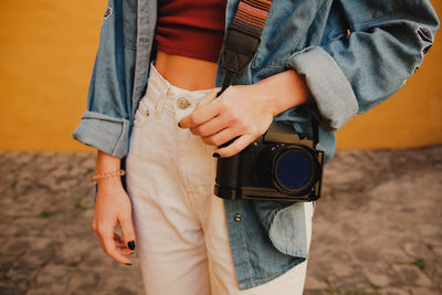 Midsection of man standing outdoors