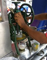 Close-up of man preparing food in kitchen