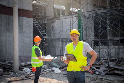 Rear view of man working at construction site