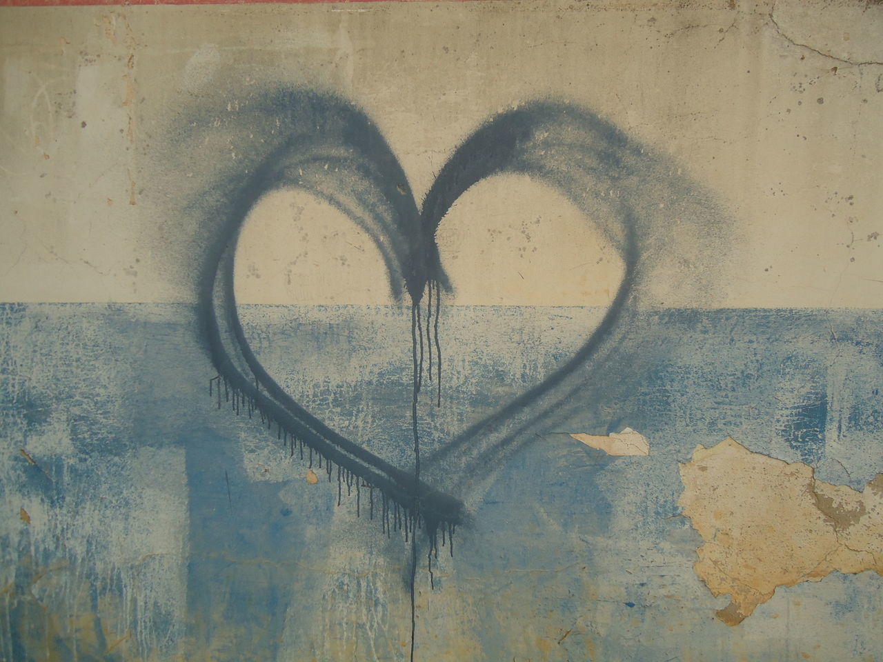 CLOSE-UP OF HEART SHAPE AGAINST WALL