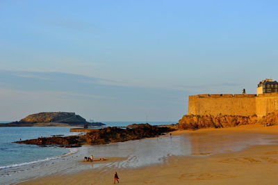 Scenic view of beach against clear sky