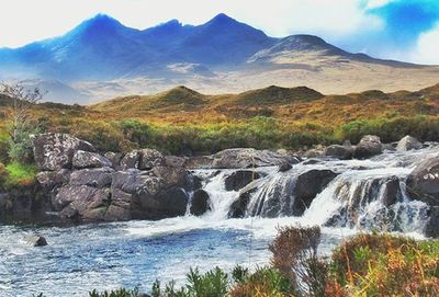 Scenic view of river and mountains