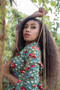 Portrait of young woman looking away