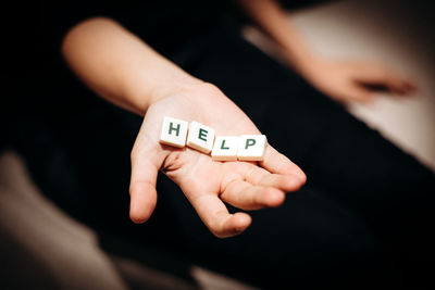 Cropped hand of woman holding toy car
