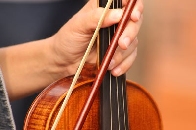 Close-up of hands playing piano