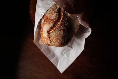 Tasty french bread in paper from bakery