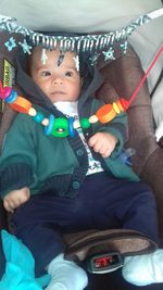 Full length of cute baby boy toy