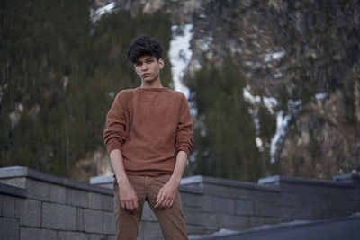 Portrait of man standing outdoors during winter