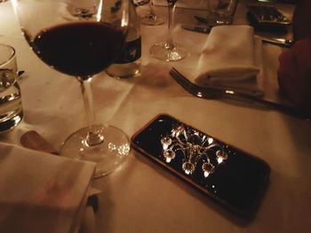 Close-up of wine glasses on table