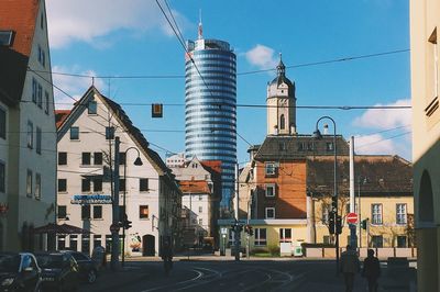 Street in city against sky