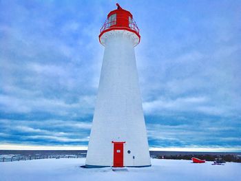 Lighthouse against sky during winter