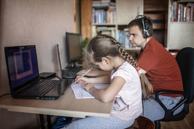 Woman using mobile phone at home