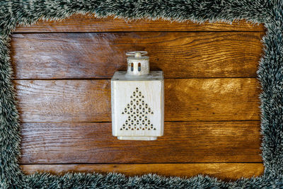 Directly above shot of electric lamp on wooden floor