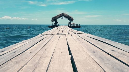 Pier over sea against sky