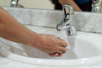 Midsection of man in bathroom