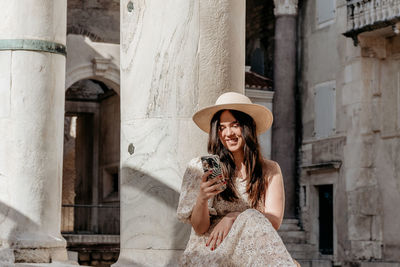 Portrait of a young woman wearing hat