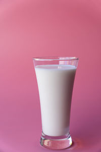 Close-up of drink against pink background