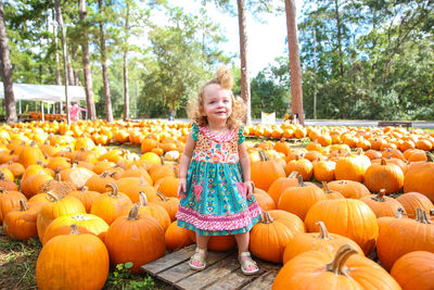 Portrait of cute girl standing in park