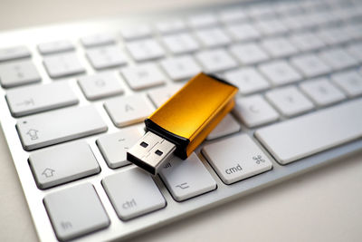 Close-up of usb stick on keyboard