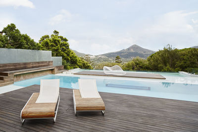 Swimming pool with deck chair