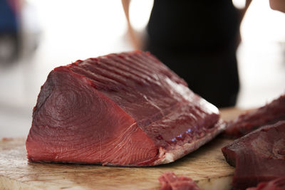 Close-up of tuna fish on cutting board