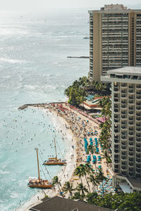 High angle view of buildings by sea