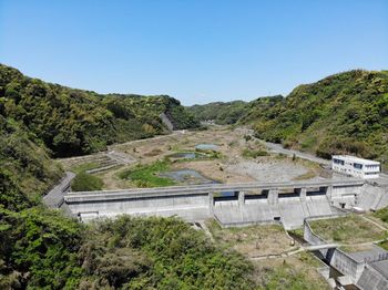 High angle view of dam against clear blue sky