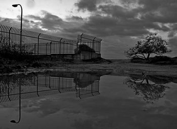 Built structure by trees against sky