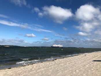 Scenic view of beach against sky