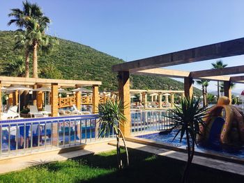 Swimming pool against clear blue sky