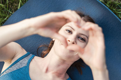 Low angle view of young woman looking away