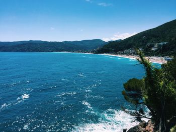 Scenic view of sea against blue sky