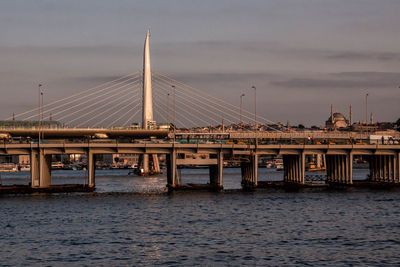 Golden horn metro bridge over sea against sky