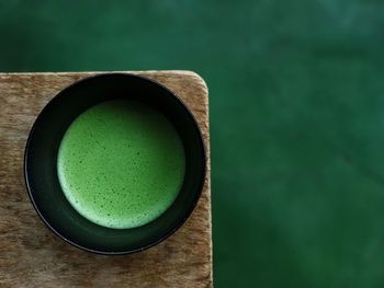 Directly above shot of drink against black background