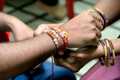 Close-up of couple holding hands