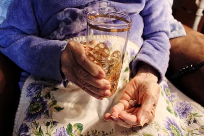 Midsection of man holding ice cream