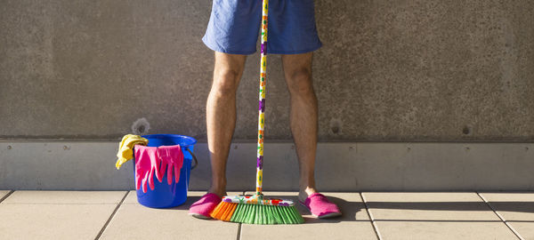 Low section of man with woman standing on floor