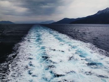 Scenic view of sea against cloudy sky