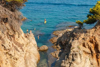 High angle view of rocks on sea