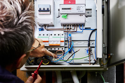 Side view of man working in workshop