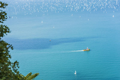 High angle view of sailboat sailing in sea